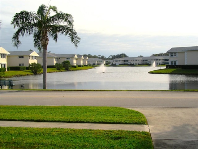 view of home's community with a water view