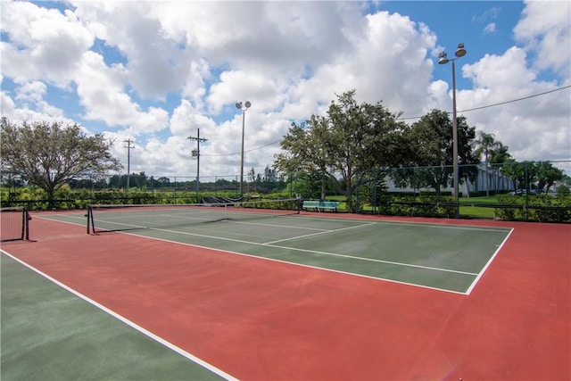 view of tennis court featuring basketball court