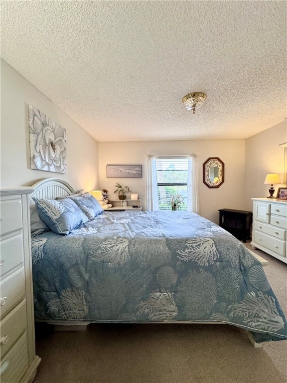 carpeted bedroom featuring a textured ceiling