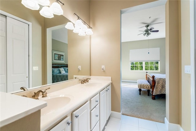 ensuite bathroom with double vanity, tile patterned flooring, ensuite bathroom, and a sink