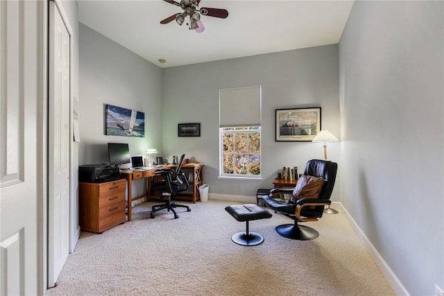 office space featuring ceiling fan, baseboards, and carpet