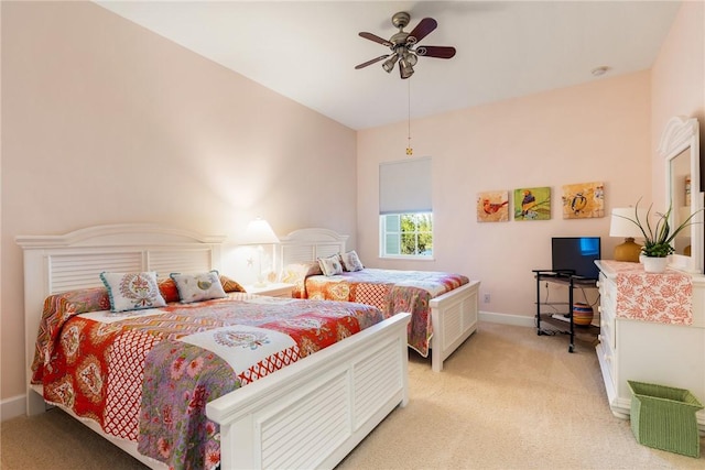 bedroom with baseboards, light colored carpet, and a ceiling fan