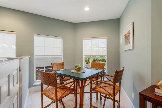 dining room featuring light tile patterned flooring, recessed lighting, and baseboards