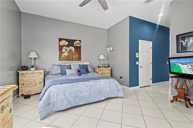 tiled bedroom featuring ceiling fan