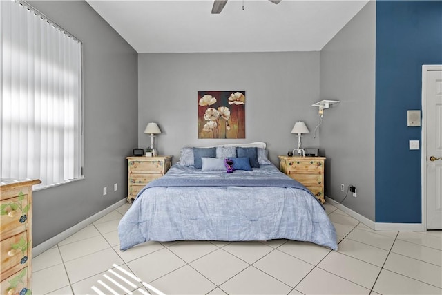 tiled bedroom with ceiling fan