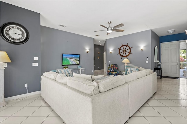 living room featuring light tile patterned flooring and ceiling fan