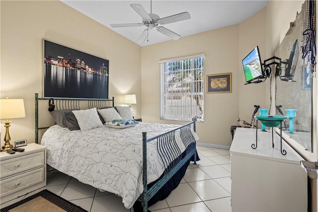 tiled bedroom featuring ceiling fan