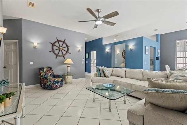 tiled living room with ceiling fan