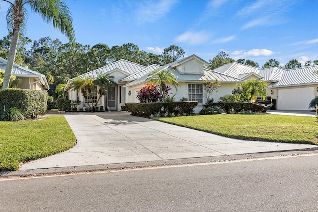 ranch-style home featuring a garage and a front yard