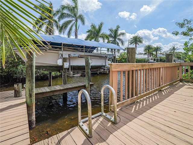 view of dock with a water view and boat lift