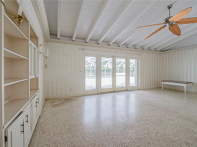 empty room featuring light speckled floor, ceiling fan, and beam ceiling