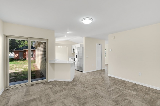 unfurnished living room featuring light parquet floors