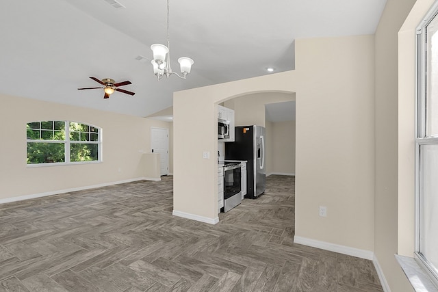 unfurnished living room with light parquet flooring and ceiling fan with notable chandelier