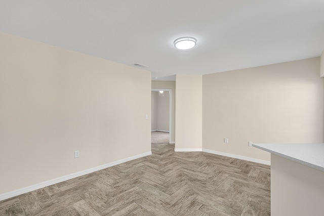 spare room featuring light parquet flooring