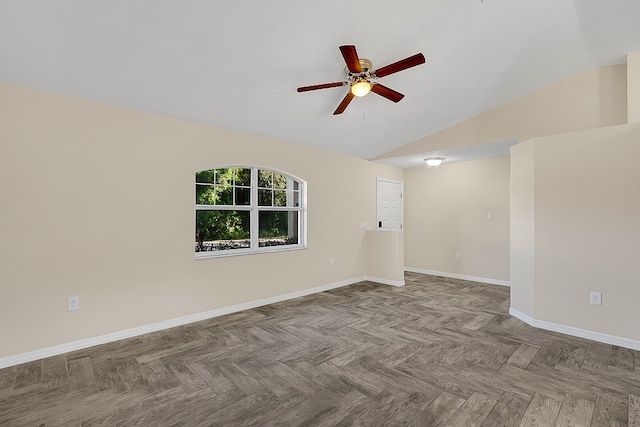 unfurnished room with ceiling fan, parquet floors, and lofted ceiling