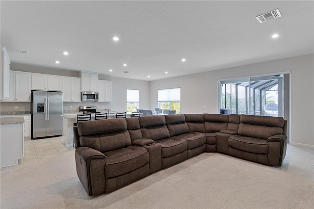 living room featuring light colored carpet