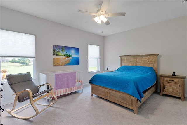 carpeted bedroom with ceiling fan