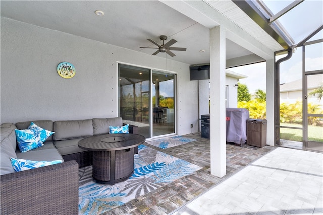 view of patio with an outdoor living space, ceiling fan, and area for grilling