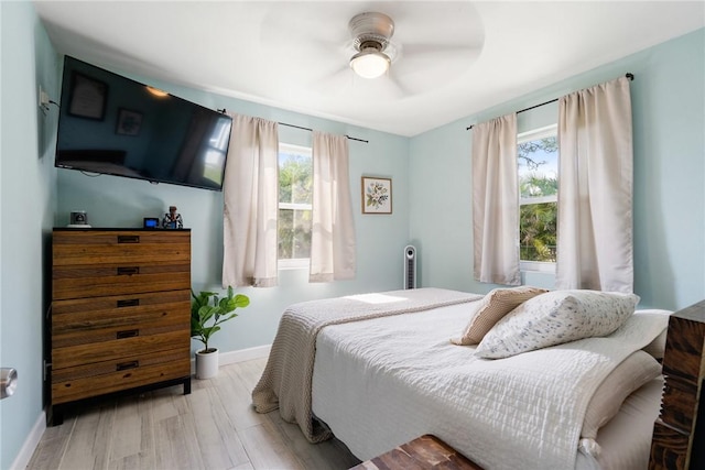 bedroom featuring ceiling fan and light wood-type flooring