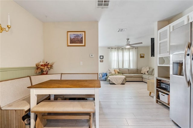 dining area featuring ceiling fan and light hardwood / wood-style flooring