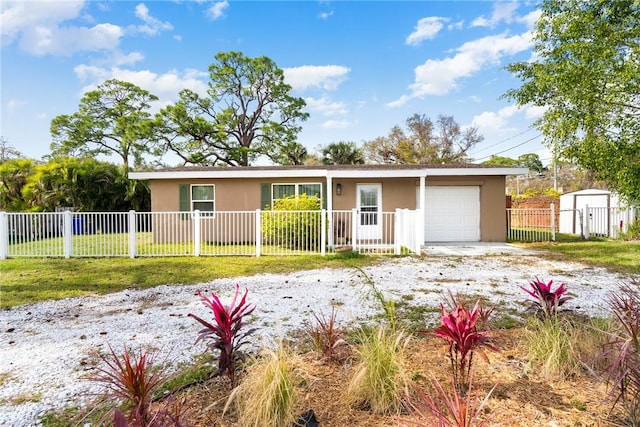 single story home with a garage and a front lawn