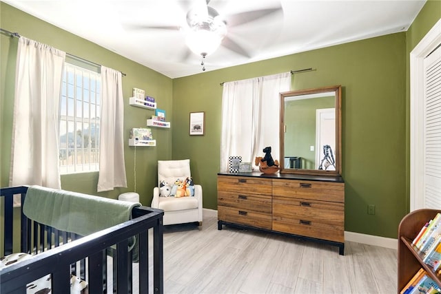 bedroom with ceiling fan and light wood-type flooring