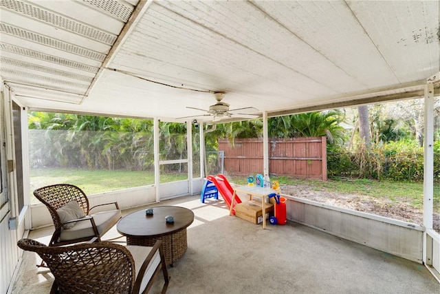 sunroom / solarium featuring ceiling fan