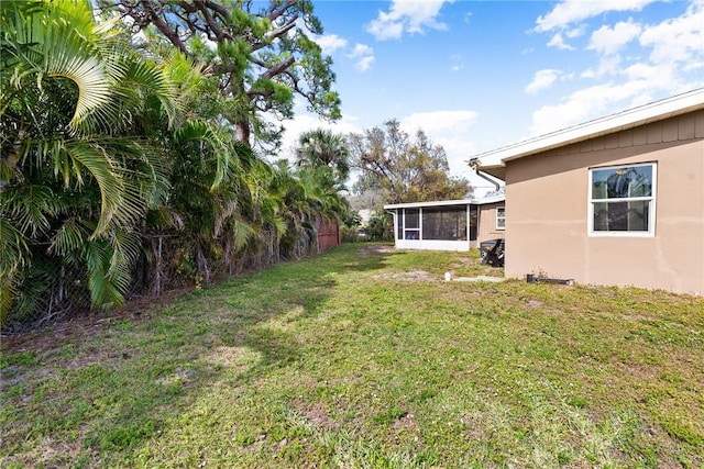 view of yard featuring a sunroom