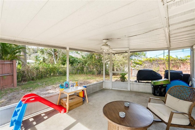 sunroom / solarium with ceiling fan