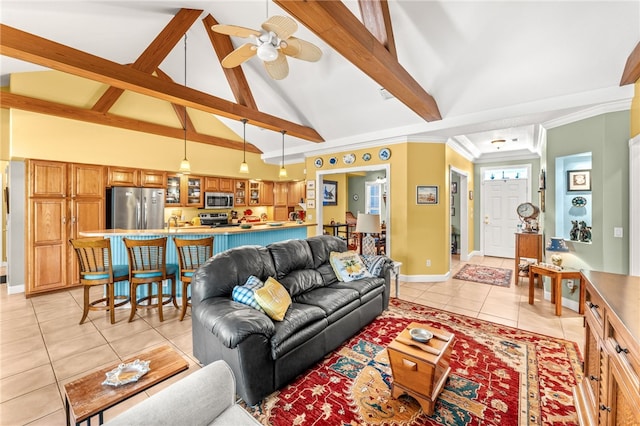 tiled living room with beamed ceiling, ceiling fan, crown molding, and high vaulted ceiling