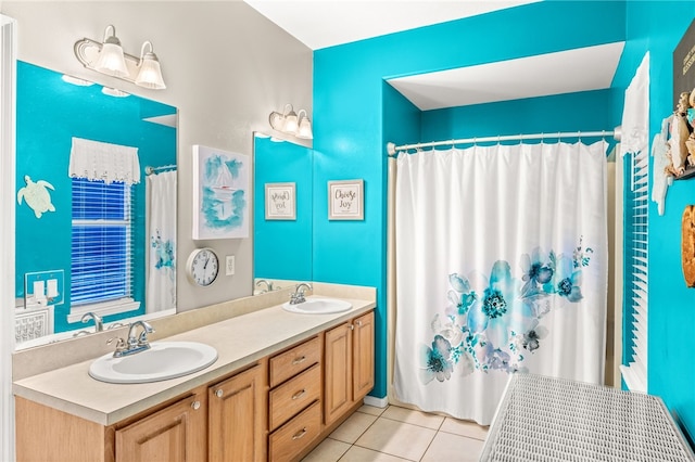 bathroom featuring tile patterned flooring and vanity