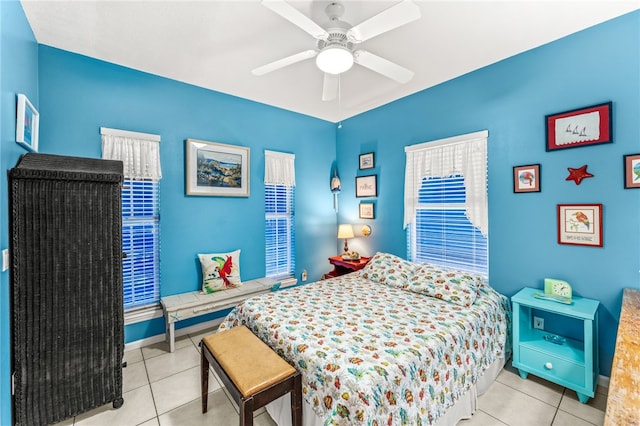 bedroom featuring light tile patterned flooring and ceiling fan