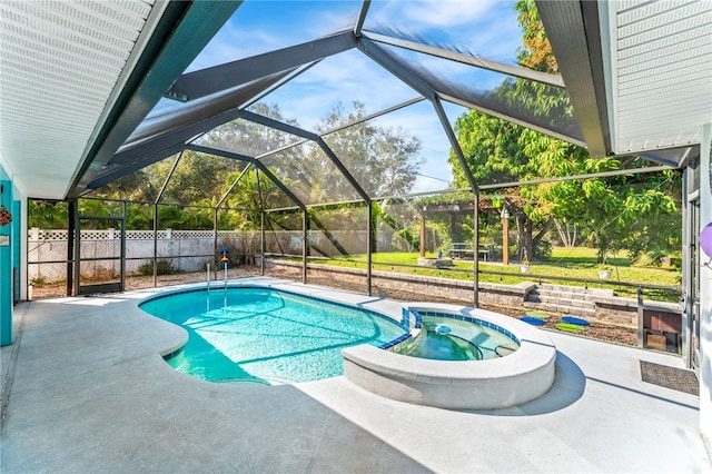 view of swimming pool featuring an in ground hot tub, a patio, and glass enclosure