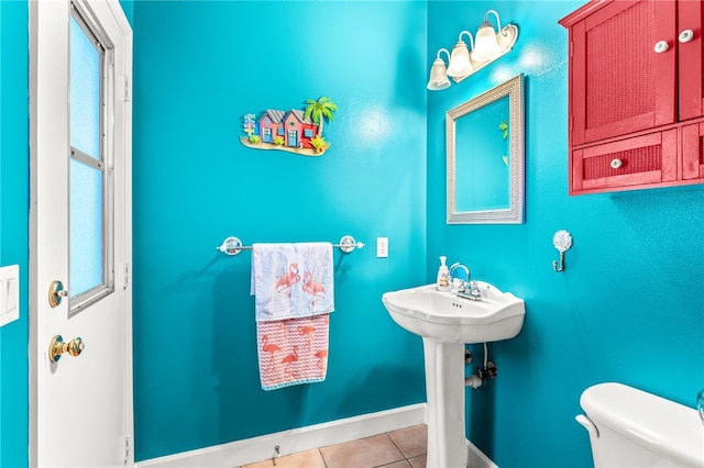 bathroom with tile patterned floors, toilet, and sink