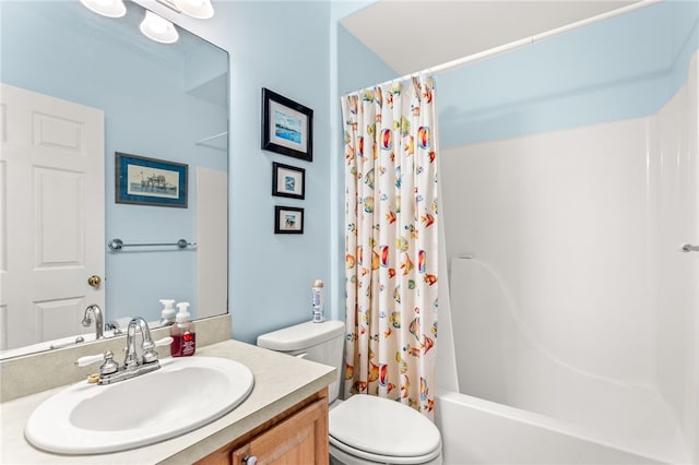 full bathroom with vanity, shower / bath combination with curtain, and toilet