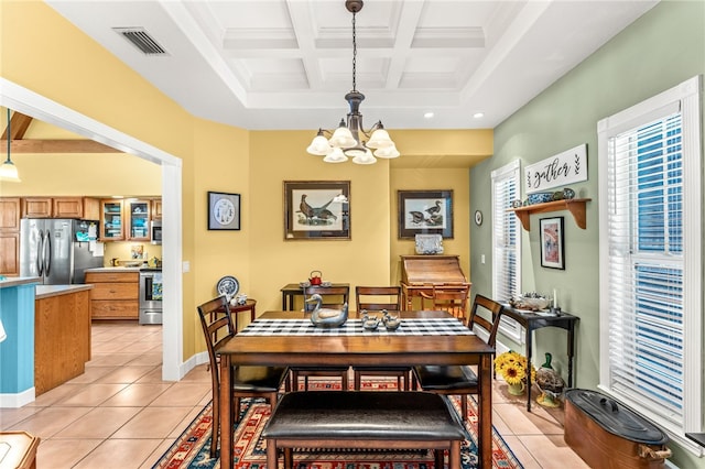 tiled dining space with beamed ceiling, coffered ceiling, and a chandelier