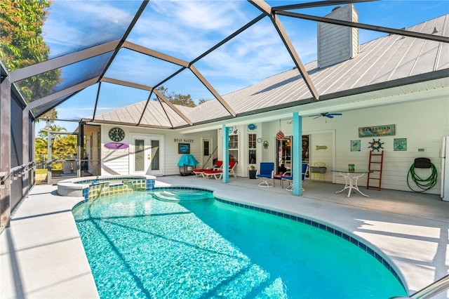 view of pool featuring a patio, an in ground hot tub, a lanai, ceiling fan, and french doors