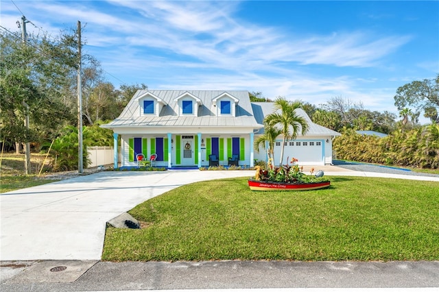 cape cod-style house featuring a garage, a front yard, and a porch