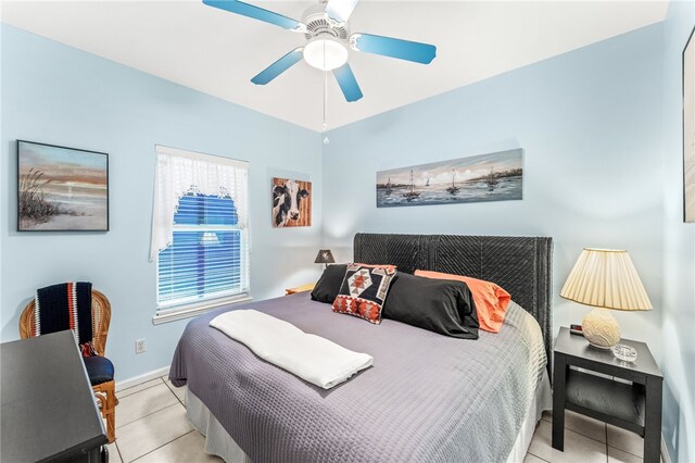 bedroom with light tile patterned floors and ceiling fan