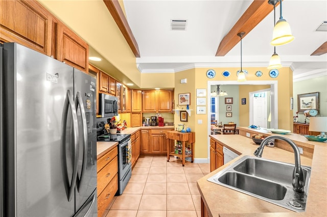 kitchen featuring sink, crown molding, hanging light fixtures, light tile patterned floors, and appliances with stainless steel finishes