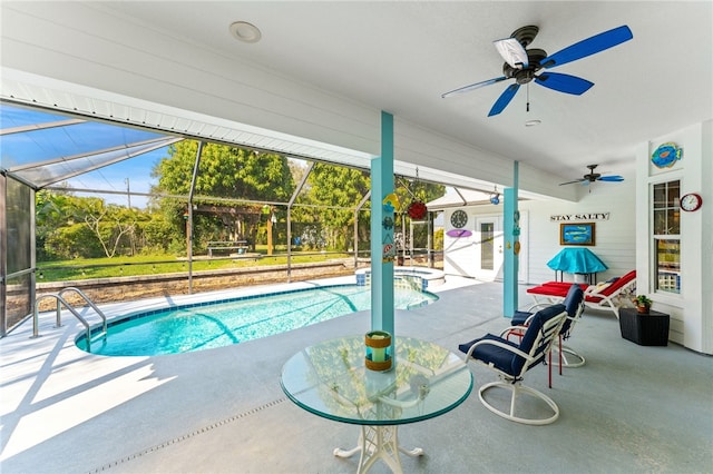 view of pool featuring a lanai, a patio, and ceiling fan