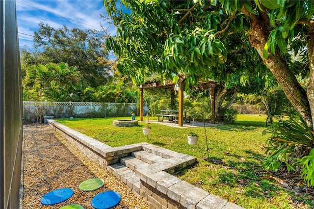 view of yard with a patio, a pergola, and a fire pit