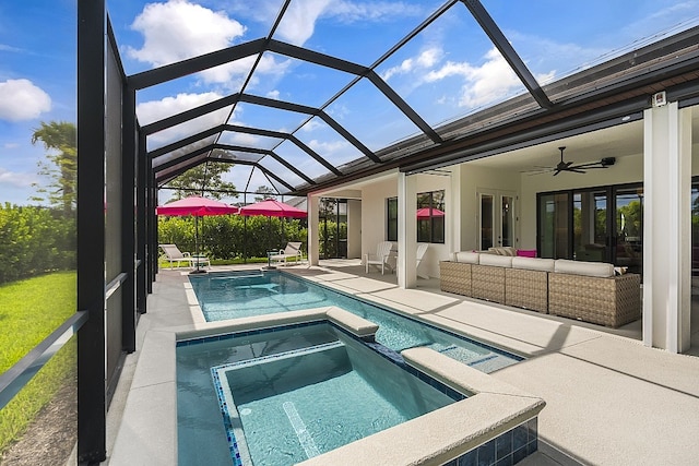 view of swimming pool featuring ceiling fan, a lanai, an outdoor living space, a patio area, and an in ground hot tub