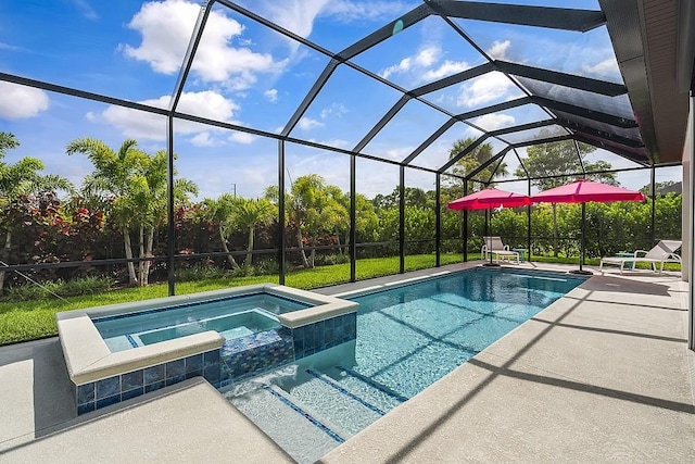 view of pool featuring glass enclosure, an in ground hot tub, and a patio