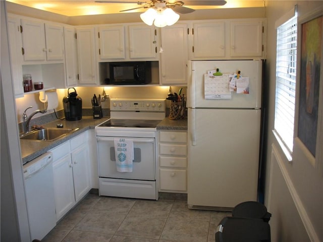 kitchen with white appliances, white cabinets, ceiling fan, light tile patterned flooring, and sink