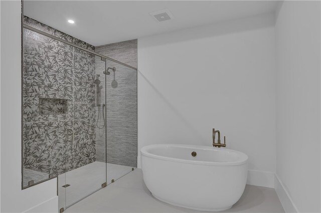 bathroom featuring tile patterned floors and an enclosed shower