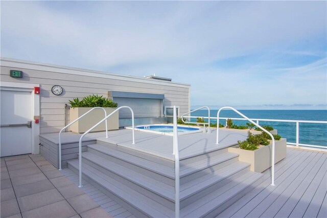 950 Surfsedge Way Unit 205, Vero Beach, FL 32963 - view of swimming pool with a hot tub and a deck with water view