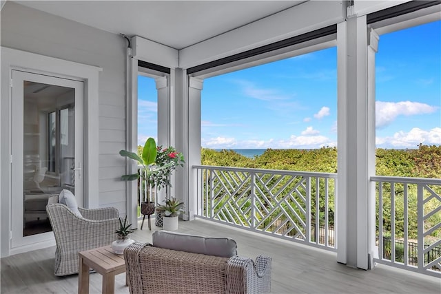 950 Surfsedge Way Unit 205, Vero Beach, FL 32963 - sunroom / solarium featuring wood finished floors and a water view