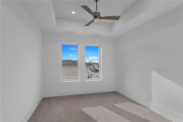 950 Surfsedge Way Unit 205, Vero Beach, FL 32963 - carpeted spare room featuring a tray ceiling, ceiling fan, and recessed lighting