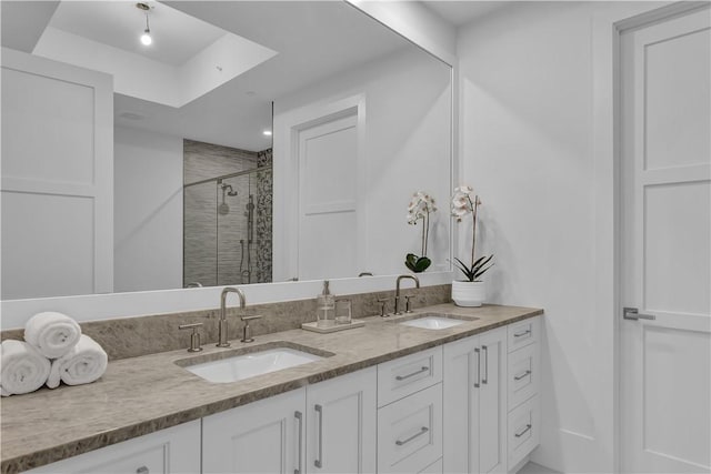 950 Surfsedge Way Unit 205, Vero Beach, FL 32963 - bathroom with a shower stall and double vanity
